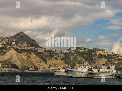 Giardini Naxos, Sicily, Italy. 12th Oct, 2004. Fishing boats sit in the harbor of the resort town of Giardini Naxos, on the east coast of Sicily. Taormina town sits above it atop the rocky peninsula overlooking Naxos Bay and the Ionian Sea. Sicily has become a popular tourist destination. Credit: Arnold Drapkin/ZUMA Wire/Alamy Live News Stock Photo