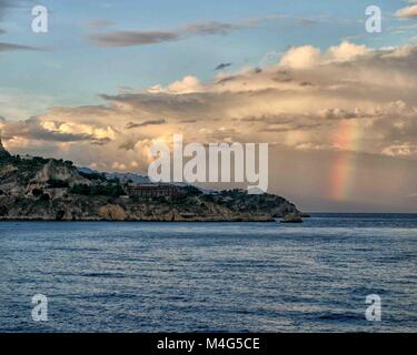 Giardini Naxos, Sicily, Italy. 12th Oct, 2004. A rainbow is visible over the Ionian Sea near the resort town of Giardini Naxos, Sicily. Sicily has become a popular tourist destination. Credit: Arnold Drapkin/ZUMA Wire/Alamy Live News Stock Photo