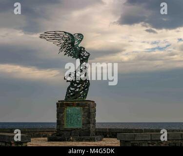 Giardini Naxos, Sicily, Italy. 12th Oct, 2004. A statue representing Nike, Goddess of Victory, by Carmelo Mendola, stands in the seaside resort town of Giardini Naxos, Sicily, Italy, overlooking the Ionian Sea. Sicily has become a popular tourist destination. Credit: Arnold Drapkin/ZUMA Wire/Alamy Live News Stock Photo