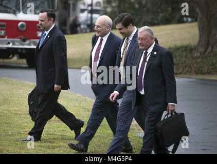 February 16, 2018 - Washington, District of Columbia, United States of America - From left to right: Dan Scavino, White House Director of Social Media and Assistant to the President; General John Kelly, White House Chief of Staff; Johnny DeStefano, Assistant to President Donald Trump and Director of the Office of Presidential Personnel; and General Joseph ''Keith'' Kellogg Jr., chief of staff and executive secretary for the National Security Council, walk to Marine One to accompany United States President Donald J. Trump from the White House in Washington, DC for a trip to Mar-a-Lago, Florida Stock Photo