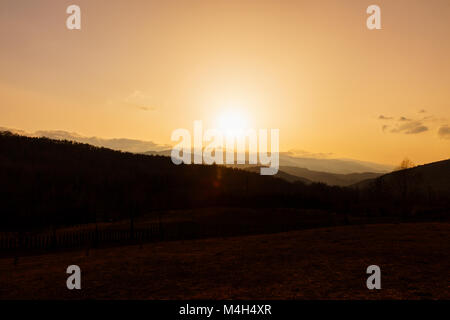 sunset over the Apuseni Mountains in Romania Stock Photo