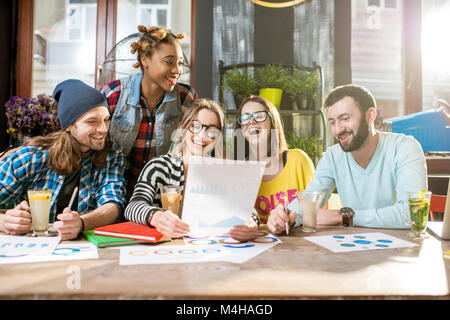 Friends working in the cafe Stock Photo