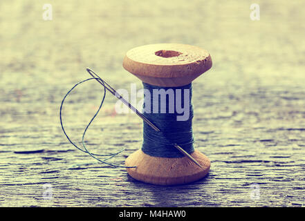 Set of color sewing threads on light grey table Stock Photo - Alamy