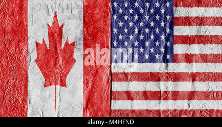 USA flag and Canada Flag on a paper in close-up Stock Photo