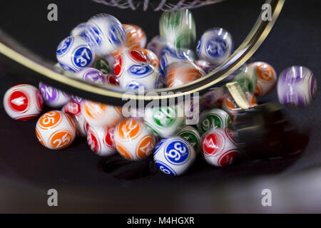 Colourful lottery balls in a machine Stock Photo