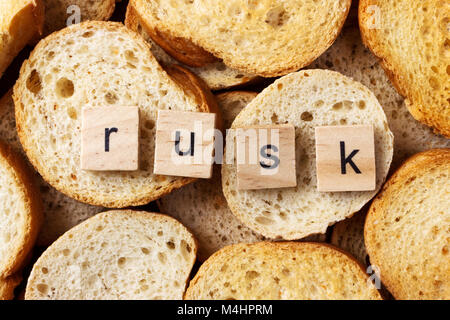 word rusk on many of round rusk background. Stock Photo
