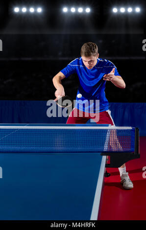 Young table tennis player in sports hall Stock Photo