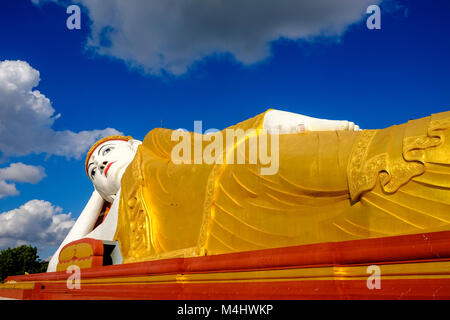 The 101 meters long Reclining Buddha statue is located in Maha Bodhi Ta Htaung near Khatakan Taung village Stock Photo