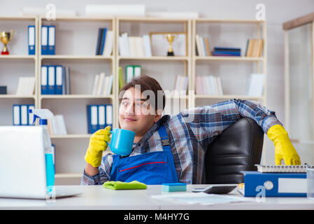 Male cleaner working in the office Stock Photo