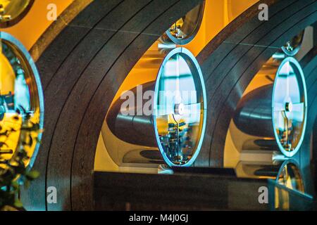 Collection of sparkling wines aging in the round luxury rack Stock Photo
