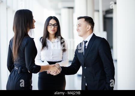 Business people shaking hands, finishing up a meeting Stock Photo