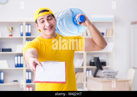 Man delivering water bottle to the office Stock Photo