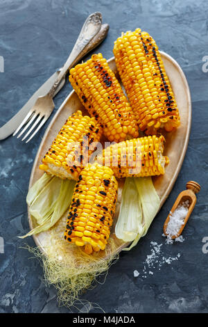 Cobs sweet corn grilled with sea salt. Stock Photo