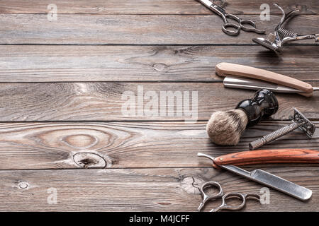 Vintage barber shop tools on wooden background Stock Photo
