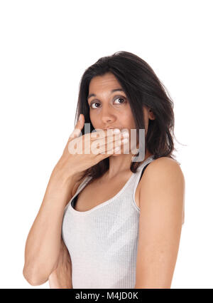 Woman holding hand over mouth looking surprised. Stock Photo