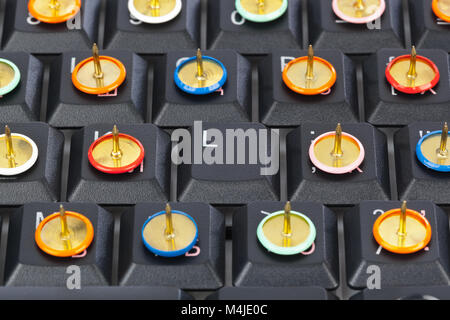 Pins on computer keyboard Stock Photo