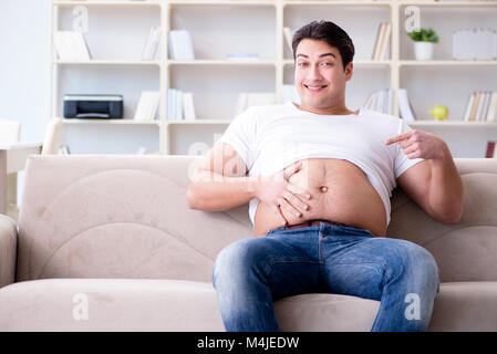 Man suffering from extra weight in diet concept Stock Photo