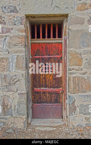 The old jailhouse door in Cimarron, New Mexicois pretty sturdy! Stock Photo