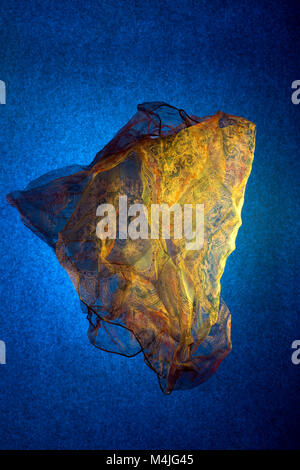 Transparent thin handkerchief on a blue background Stock Photo