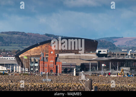 A view across Cardiff Bay towards the Pierhead Building and Wales Millennium Centre from the Cardiff Bay barrage Stock Photo