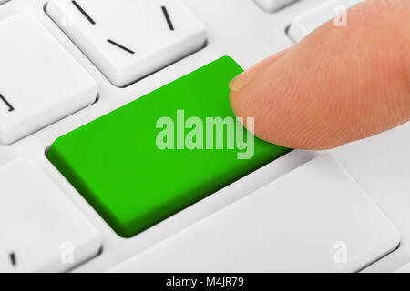Computer notebook keyboard with blank green key Stock Photo
