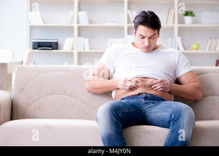 Man suffering from extra weight in diet concept Stock Photo