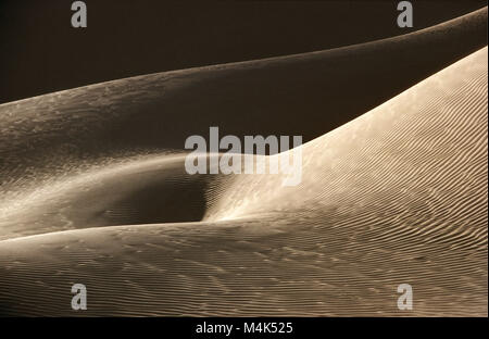 Algeria. Kerzaz. Western Sand Sea. Grand Erg Occidental. Sahara desert. Close up Sand Dune and shadow Stock Photo