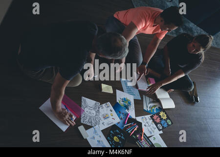 Business colleagues discussing over documents Stock Photo