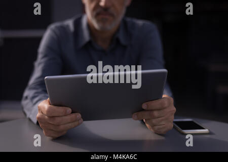 Businessman holding digital tablet Stock Photo