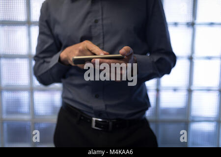 Businessman using a smart phone Stock Photo