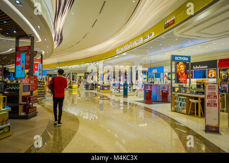 SINGAPORE, SINGAPORE - JANUARY 30, 2018: Indoor view of unidentified people buying things inside of a stores at Singapore Changi Airport Stock Photo