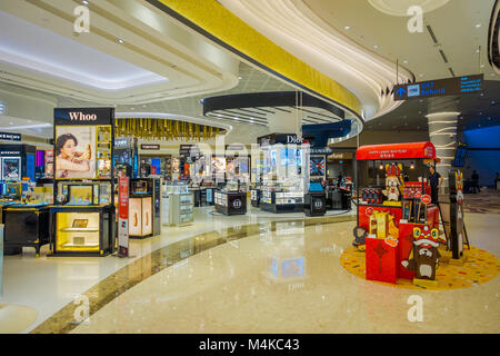 SINGAPORE, SINGAPORE - JANUARY 30, 2018: Indoor view of unidentified people buying things inside of a stores at Singapore Changi Airport Stock Photo