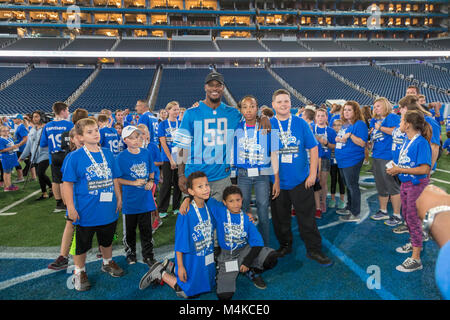 Detroit, Michigan - Students pose with Detroit Lions linebacker Tahir Whitehead after a physical activity and nutrition program at Ford Field. The pro Stock Photo