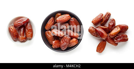 Pitted dates isolated on white background, top view
