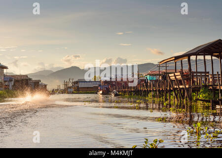 Maing Thauk: wooden bridge into Inle Lake, boat, Inle Lake, Shan State, Myanmar (Burma) Stock Photo