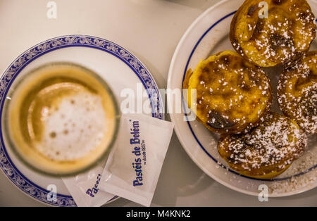Pastel de nata and milk coffee at Pasteis de Belem in Lisbon, Portugal. Stock Photo