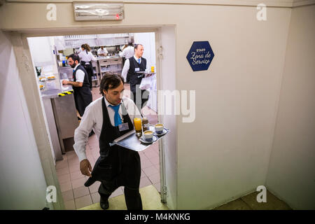A waiter leaving the kitchen at Pasteis de Belem in Lisbon, Portugal. Stock Photo