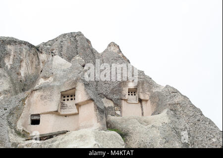 Ancient, carved rock houses in Cappadocia, Turkey Stock Photo