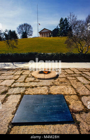 Graves of President John F. Kennedy and his brother Robert Kennedy at Arlington Cemetery National Cemetery. The John F. Kennedy Eternal Flame is a presidential memorial at the gravesite of U.S. President John F. Kennedy, in Arlington National Cemetery. The permanent site replaced a temporary grave and eternal flame used during President Kennedy's funeral on November 25, 1963. The site was designed by architect John Carl Warnecke, a long-time friend of the President.[1][2] The permanent John F. Kennedy Eternal Flame grave site was consecrated and opened to the public on March 15, 1967 Stock Photo