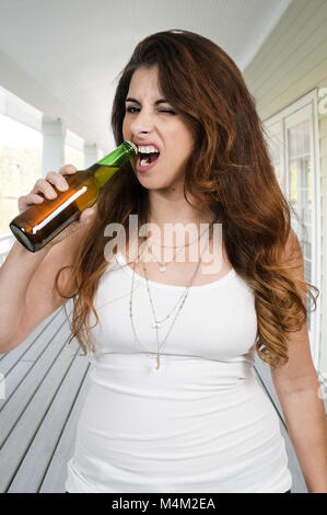 Woman opening a beer Stock Photo