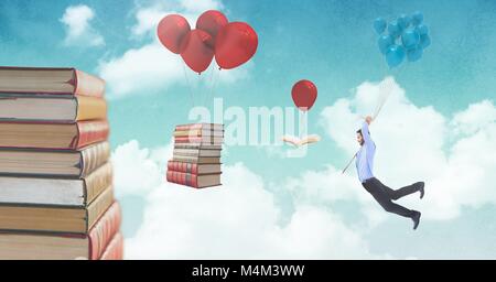 Man holding balloons and floating books on balloons in surreal sky Stock Photo