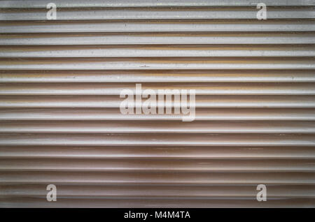 Teal brown painted horizontal metal window roller shutter blinds or garage doors background texture. Stock Photo