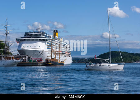 Boat sailing near a Stena line cruise in Oslo, Norway Stock Photo