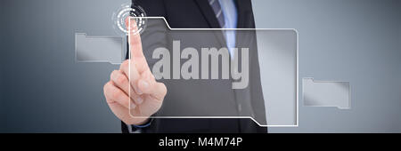 Composite image of mid section of businessman pointing something up Stock Photo