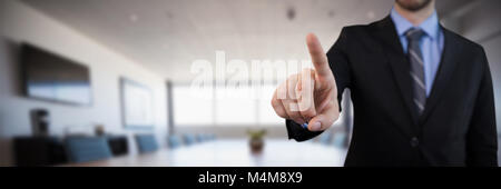 Composite image of mid section of businessman in suit selecting over invisible interface Stock Photo