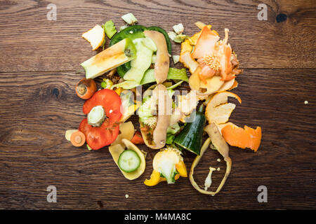 Elevated View Of Vegetable And Fruit Peelings On Wooden Table Stock Photo