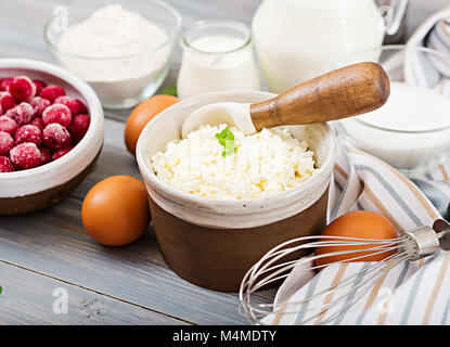 Ingredients for the preparation of cottage cheese casserole with cherries. Tasty breakfast Stock Photo
