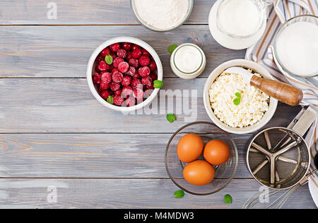 Ingredients for the preparation of cottage cheese casserole with cherries. Tasty breakfast. Top view Stock Photo