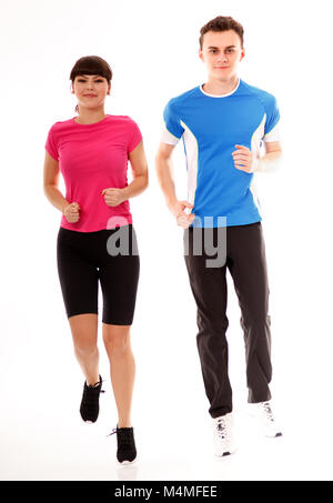 Athletic couple of teenagers running, full length over white background Stock Photo