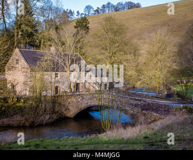 Lode Mill on the Staffordshire bank of the River Dove at Milldale in the Peak District National Park UK Stock Photo